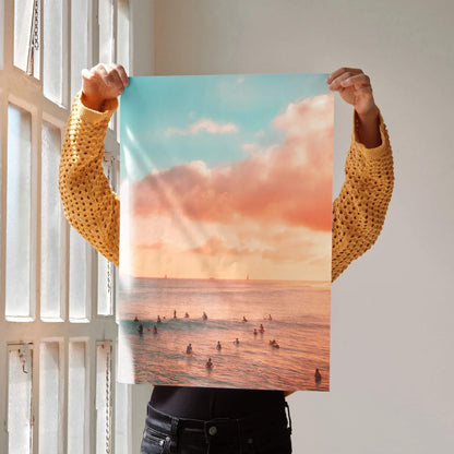 Vertical ocean sunset poster with warm orange sky and silhouetted surfers, wall art print.