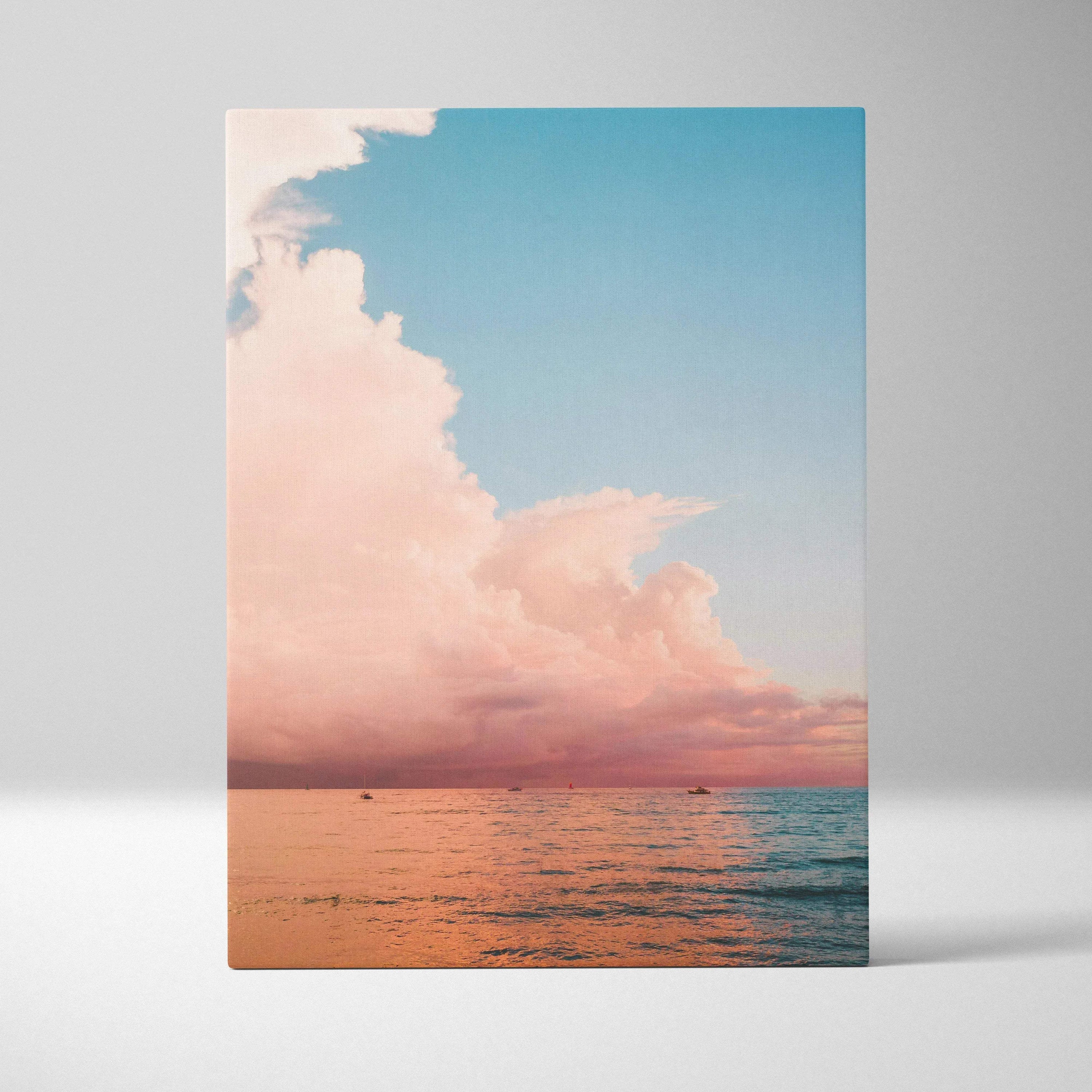 Ocean sunset beach scene with soft pink clouds over calm water on canvas wall art.