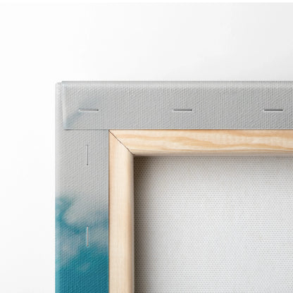Close-up of wooden frame corner on canvas wall art with ocean blue and gray paint details.