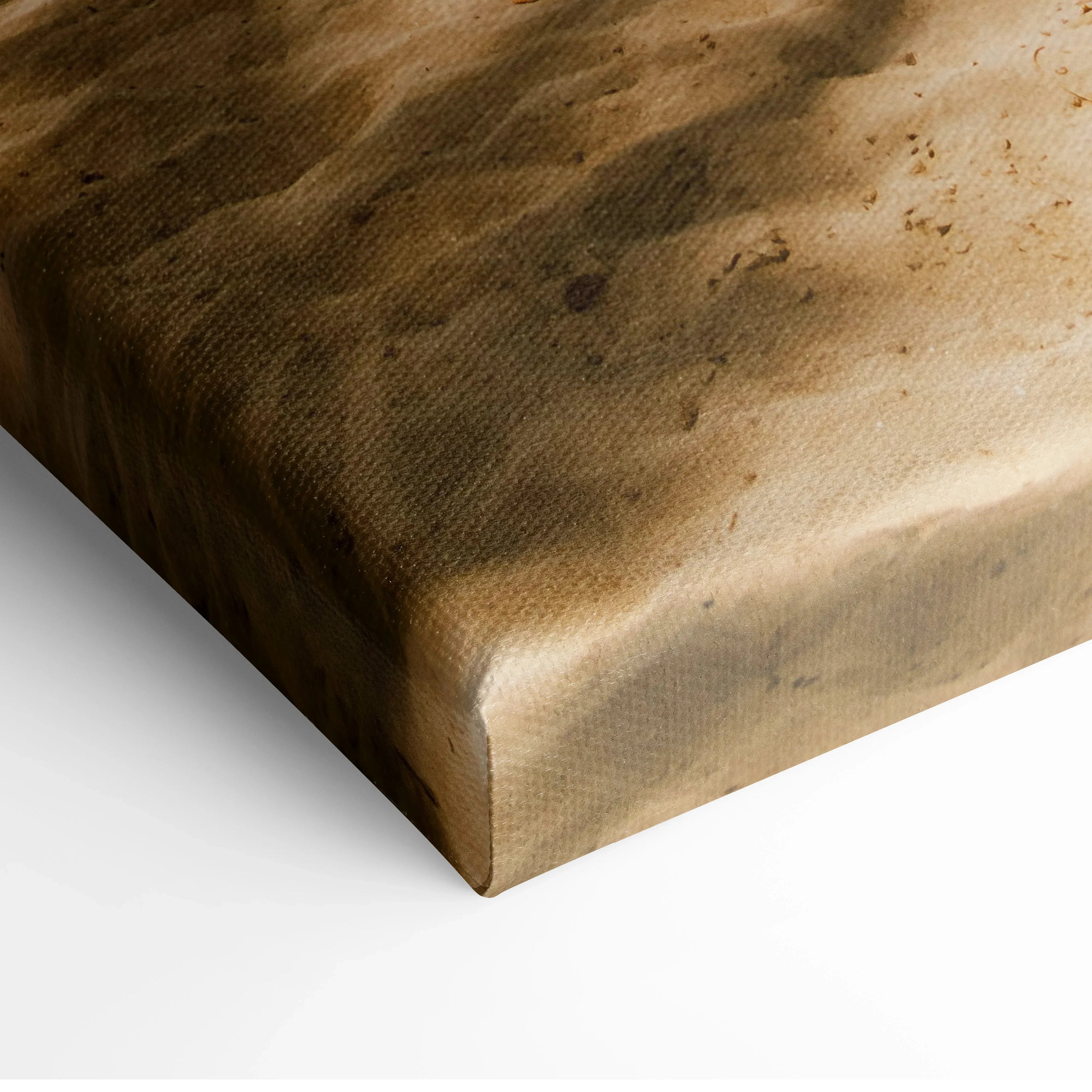 Close-up of textured canvas wall art showing sandy beach detail in warm tones.