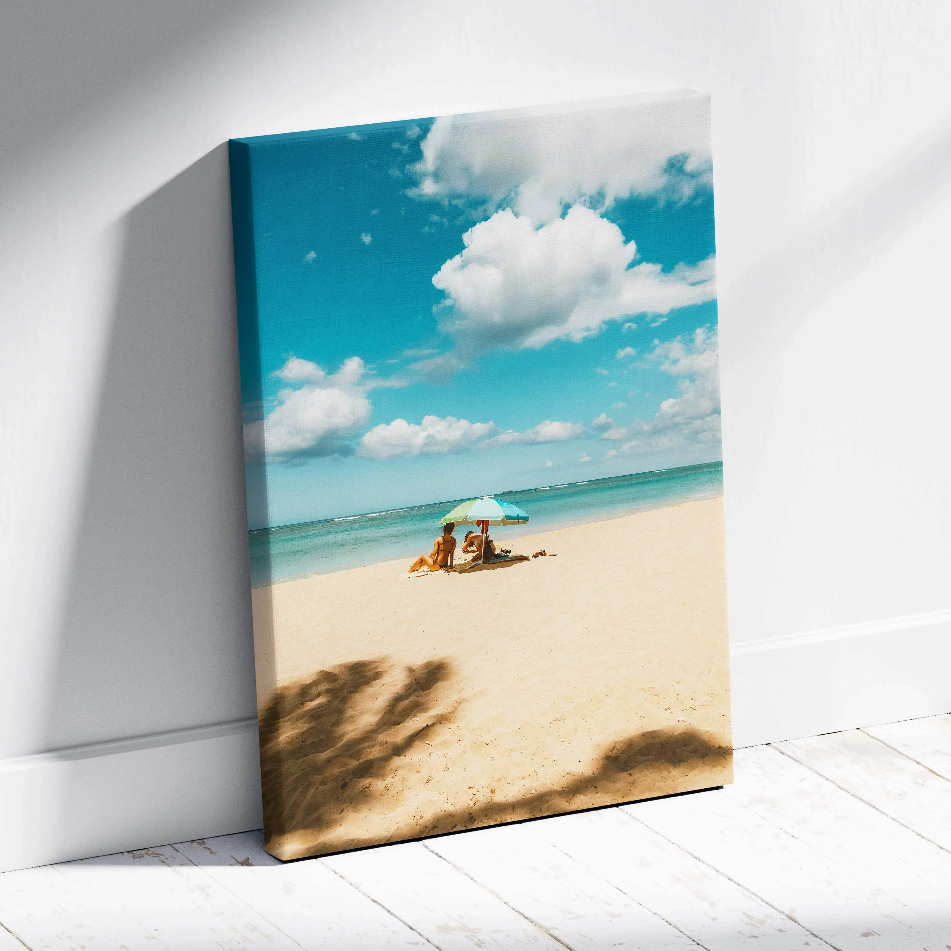 Calming ocean beach seascape canvas wall art featuring a turquoise umbrella and two people on golden sand