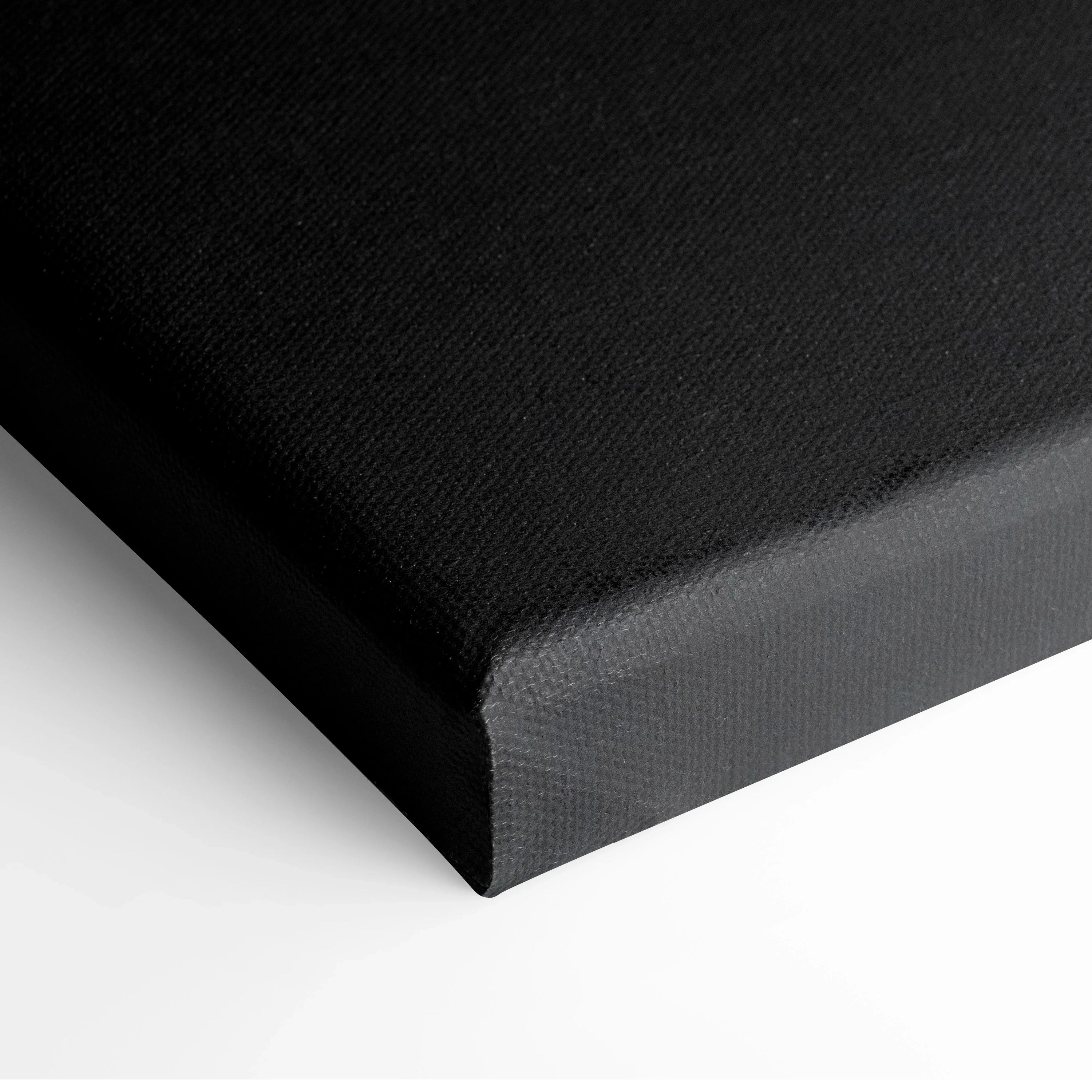 Close-up of black canvas edge over white background showcasing texture for wall art print.