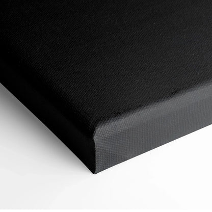Close-up of black canvas edge over white background showcasing texture for wall art print.