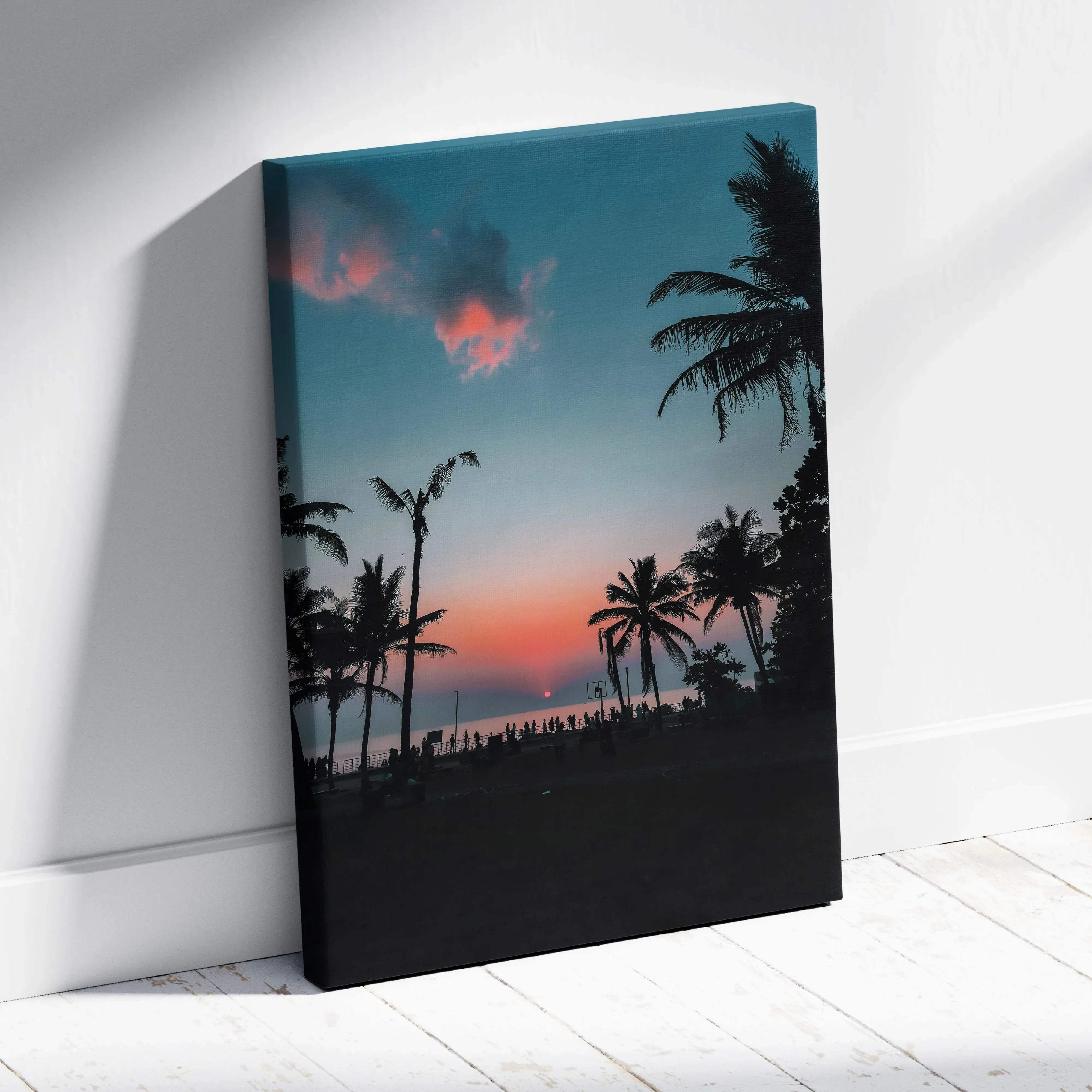 A vibrant tropical beach sunset canvas wall art with palm tree silhouettes against a teal pink and orange sky