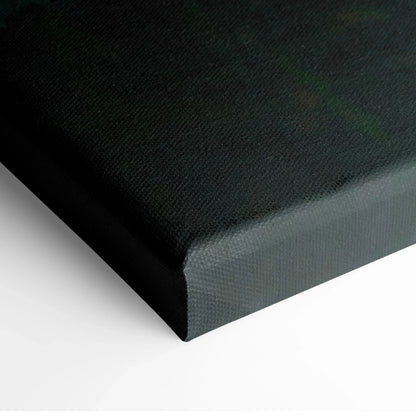 Close-up of black canvas wrap edge on vertical wall art panel.