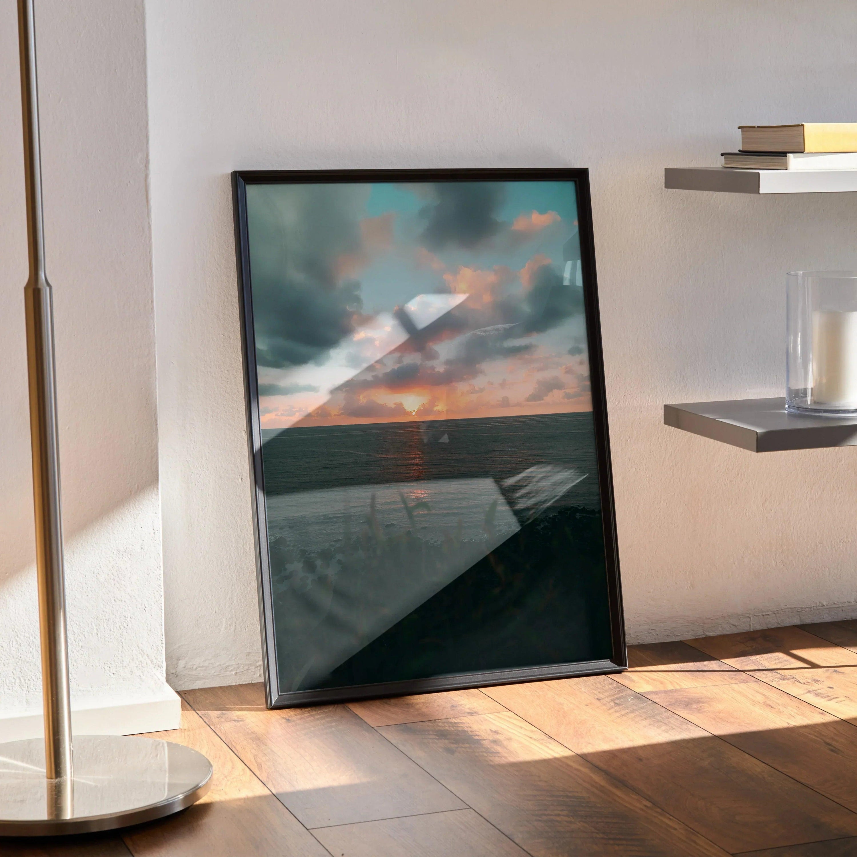 Ocean sunset beach poster with vibrant orange sun and cloudy sky in black frame wall art.