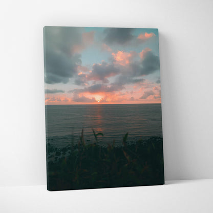 Beach sunset over ocean with dramatic clouds on vertical canvas wall art.