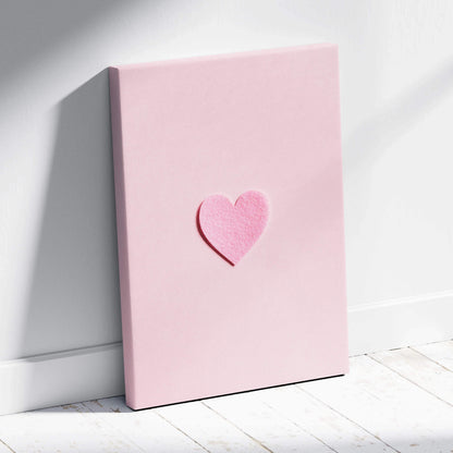 Minimal pink felt heart on pastel pink canvas wall art flat lay