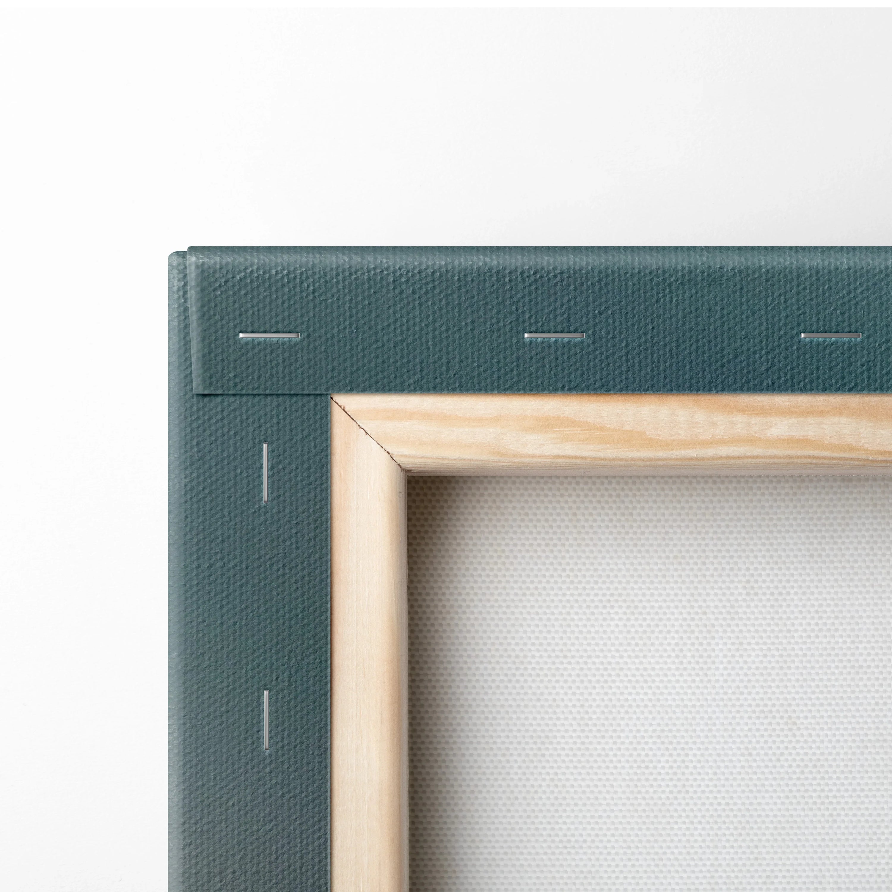 Corner detail of wooden frame and stretched canvas for wall art print.