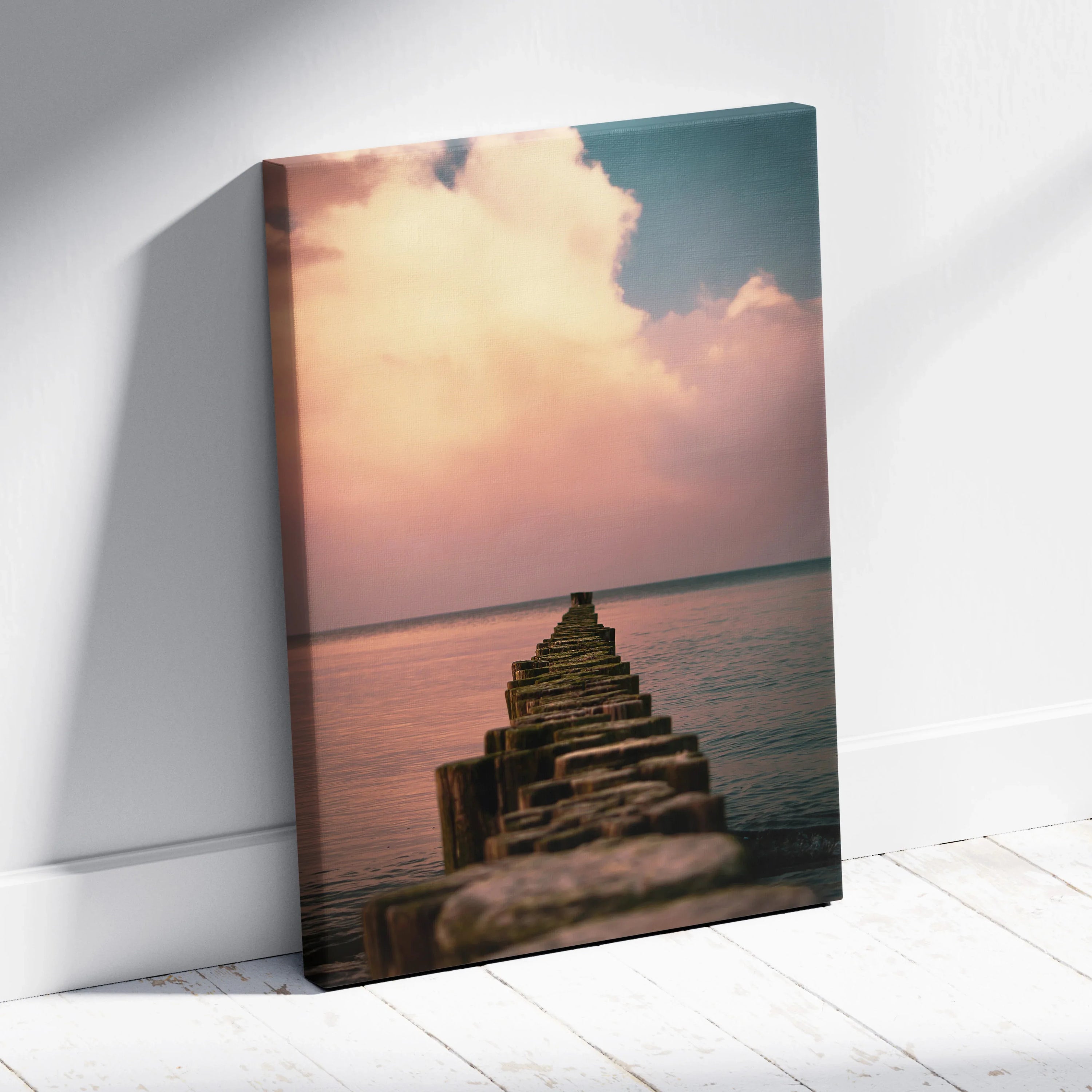 Vertical canvas wall art featuring a wooden pier extending into calm ocean waters under a soft sunset sky with pastel clouds.