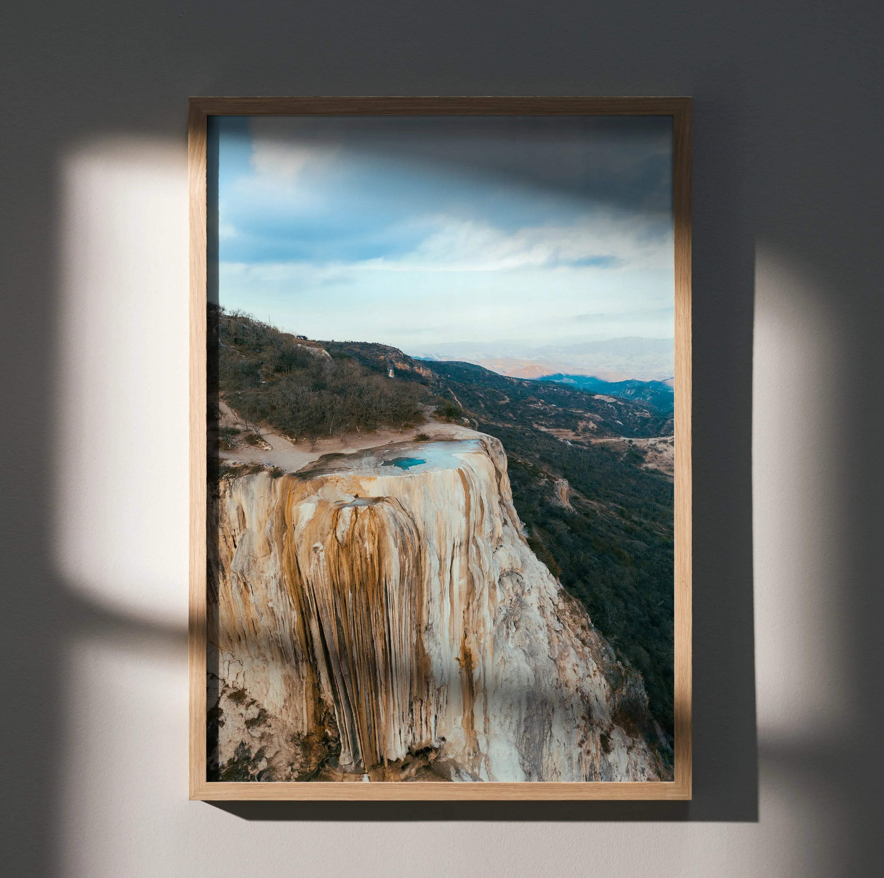 Vertical mountain landscape poster with rocky cliffs and distant forest, wall art in natural tones.