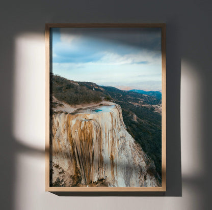 Vertical mountain landscape poster with rocky cliffs and distant forest, wall art in natural tones.