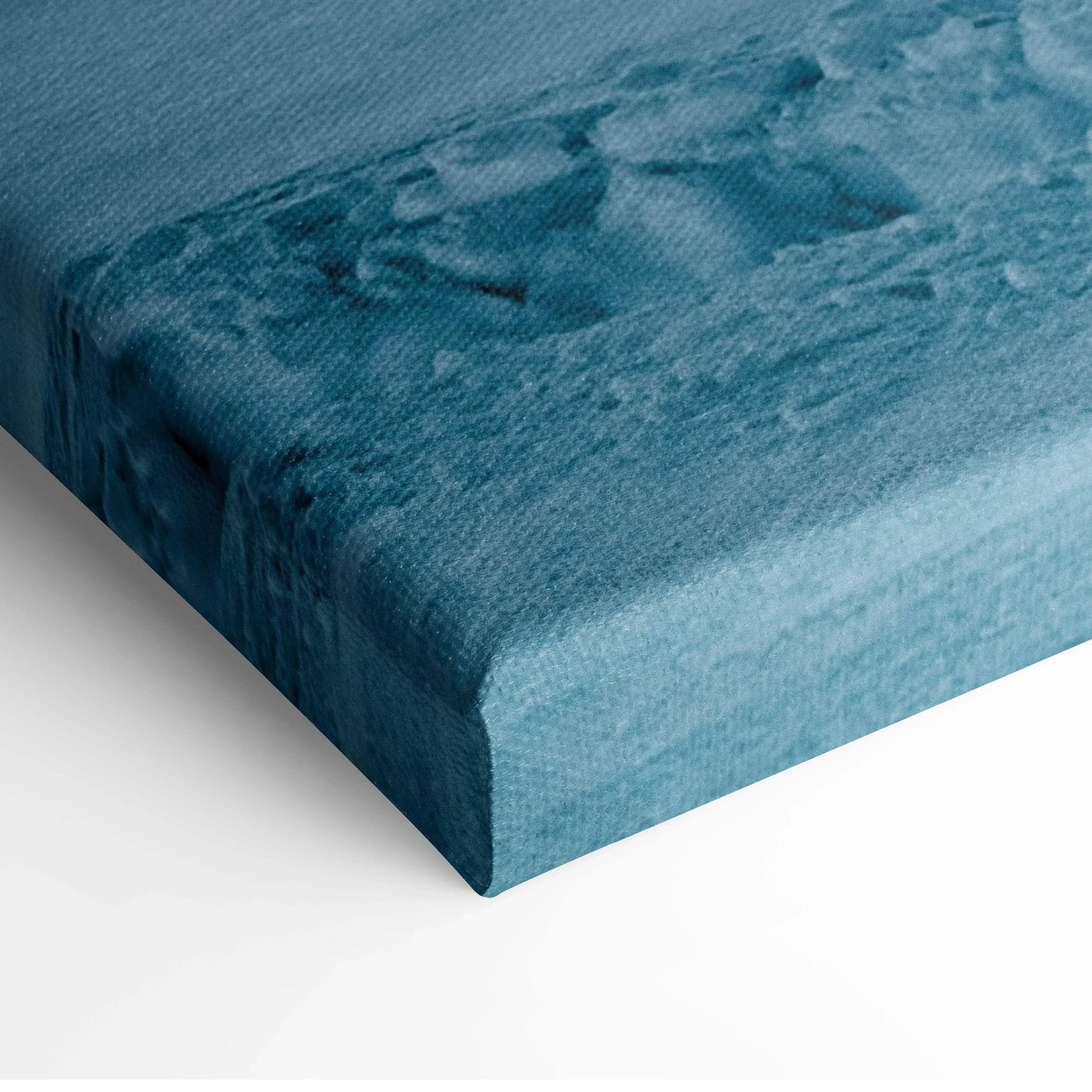 Blue-toned snowy winter landscape canvas wall art with textured snow details on thick gallery wrap.