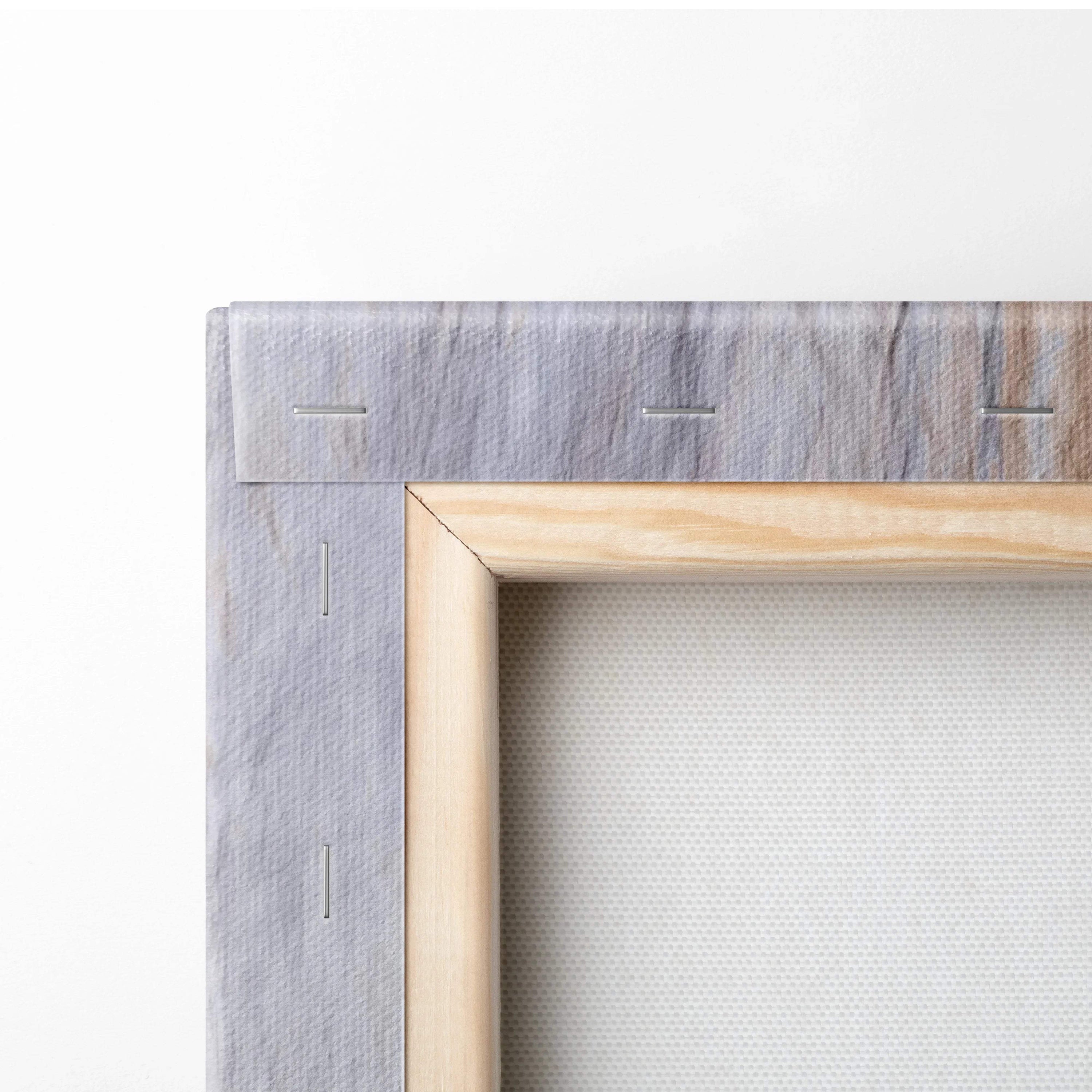 Back of light wood canvas frame with gray textured backing and stitching for abstract forest art