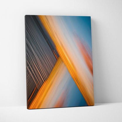 Abstract city skyline motion blur sunset canvas art in gold orange blue tones