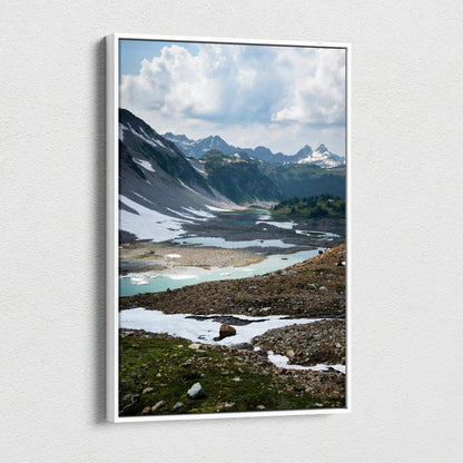 Mountain landscape with snow patches and cloudy sky on canvas wall art.