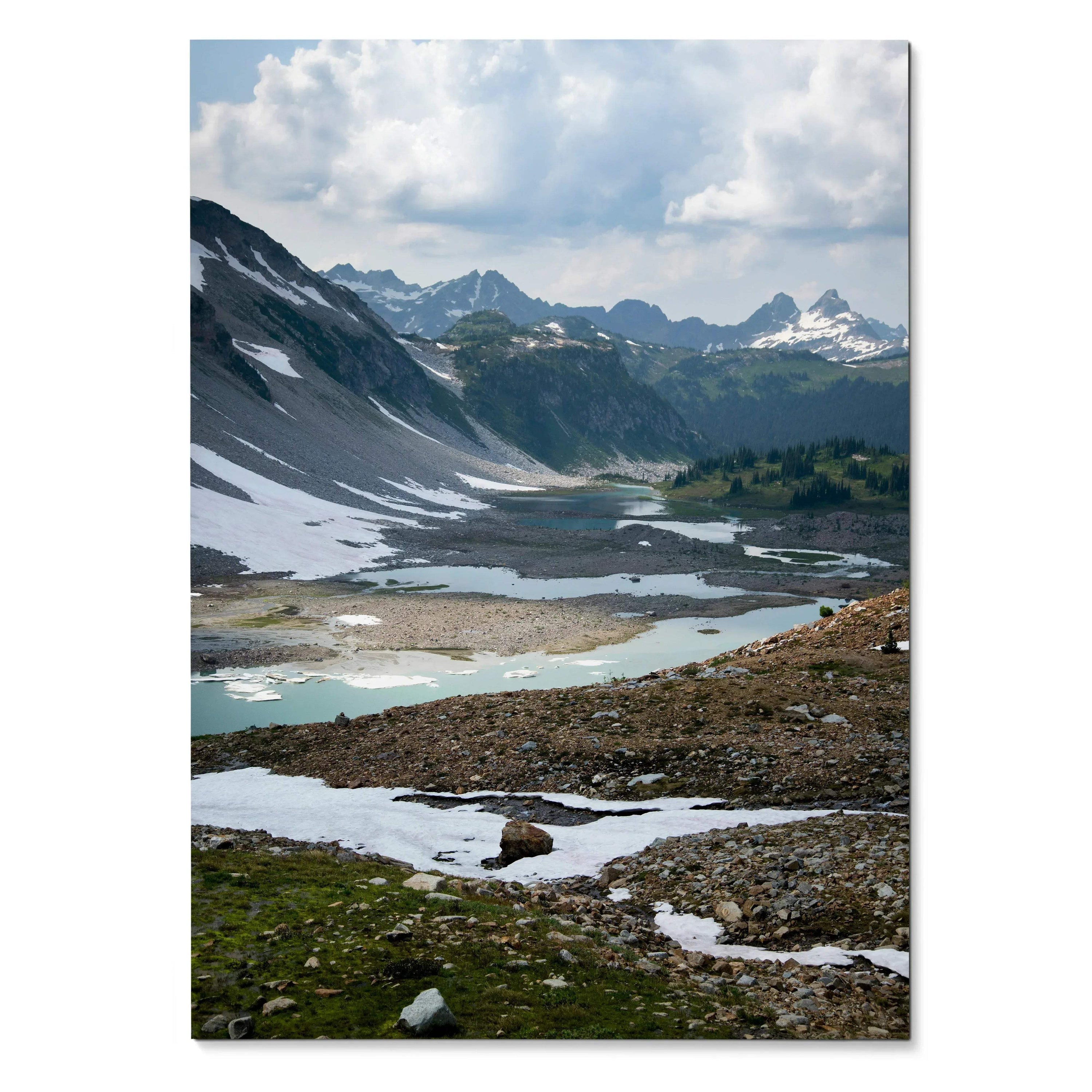 Vertical mountain landscape poster with snow patches, rocky terrain, and cloudy sky wall art.