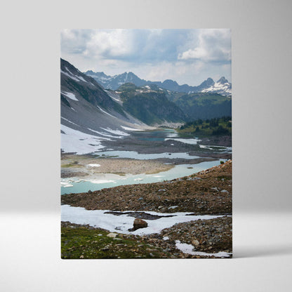 Mountain landscape canvas wall art featuring snow-capped peaks and alpine lake.