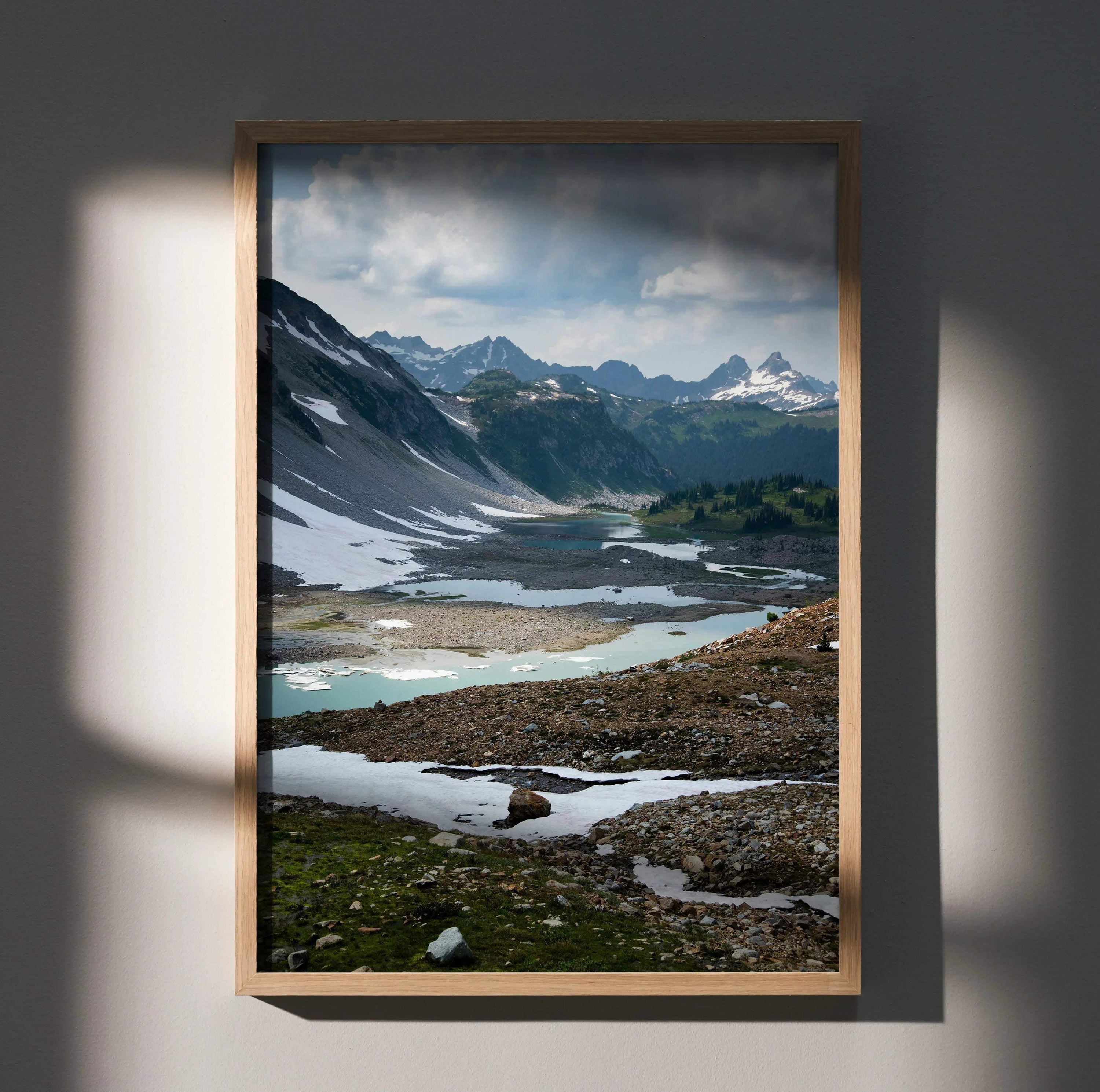 Majestic mountain landscape wall art poster with snowy peaks and reflective alpine lakes in vertical frame.