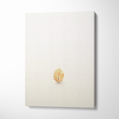 Minimalist dried golden leaf on warm beige canvas wall art