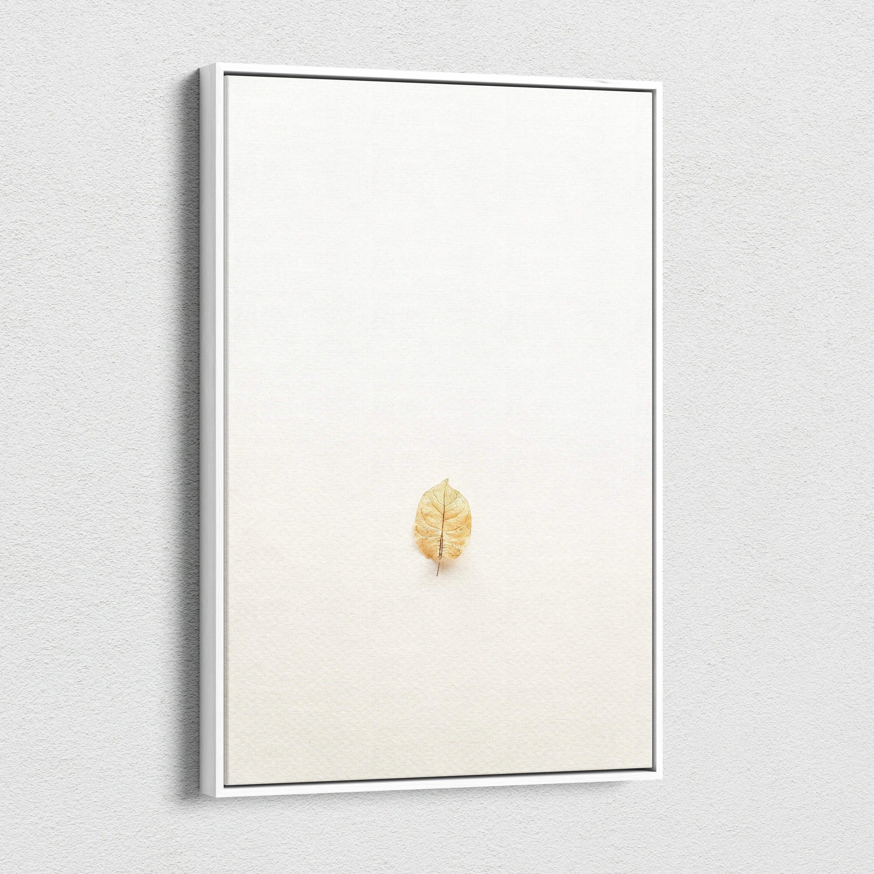 Minimalist dried golden leaf on warm beige canvas wall art