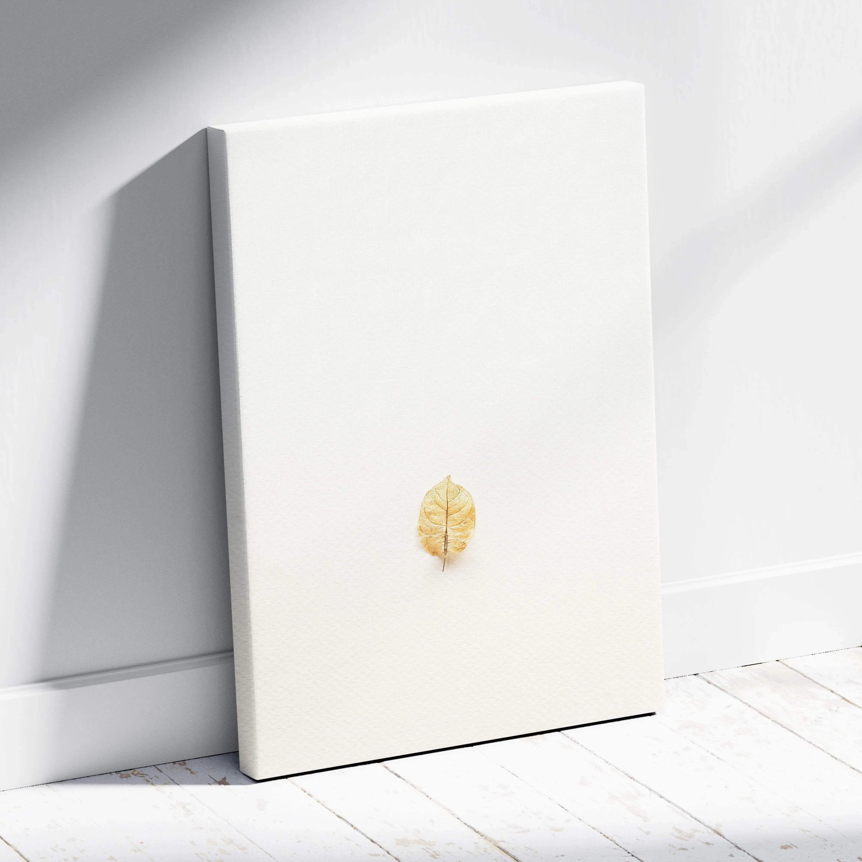 Minimalist golden leaf on white canvas wall art in neutral tones