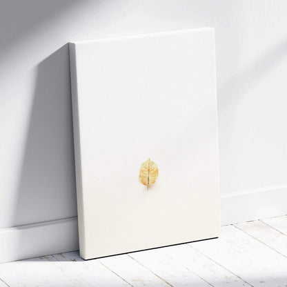 Minimalist golden leaf on white canvas wall art in neutral tones