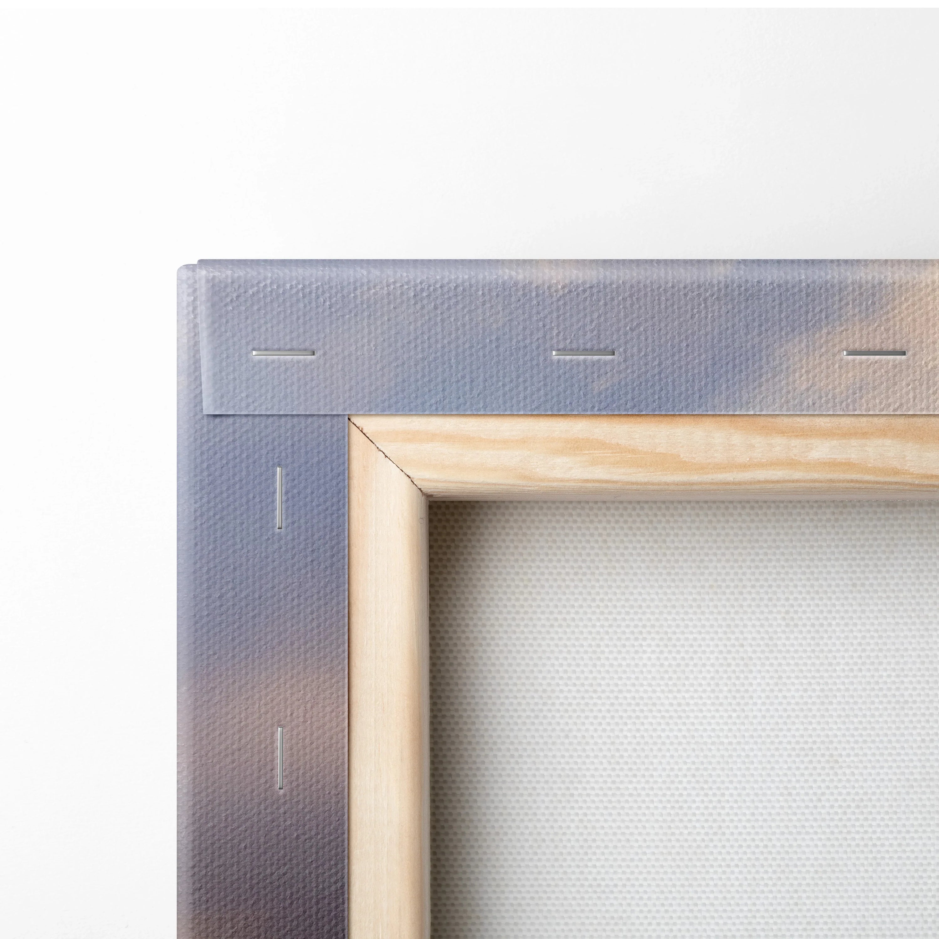 Close-up of wooden frame and canvas texture on stretched wall art canvas panel.