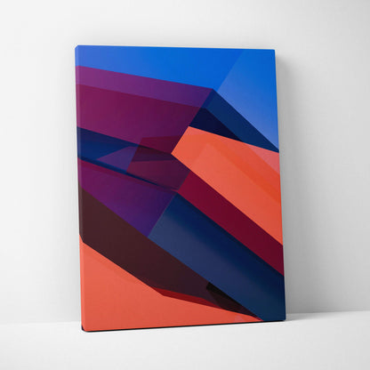 Bold geometric canvas wall art with layered diagonal shapes in blue navy coral red tones