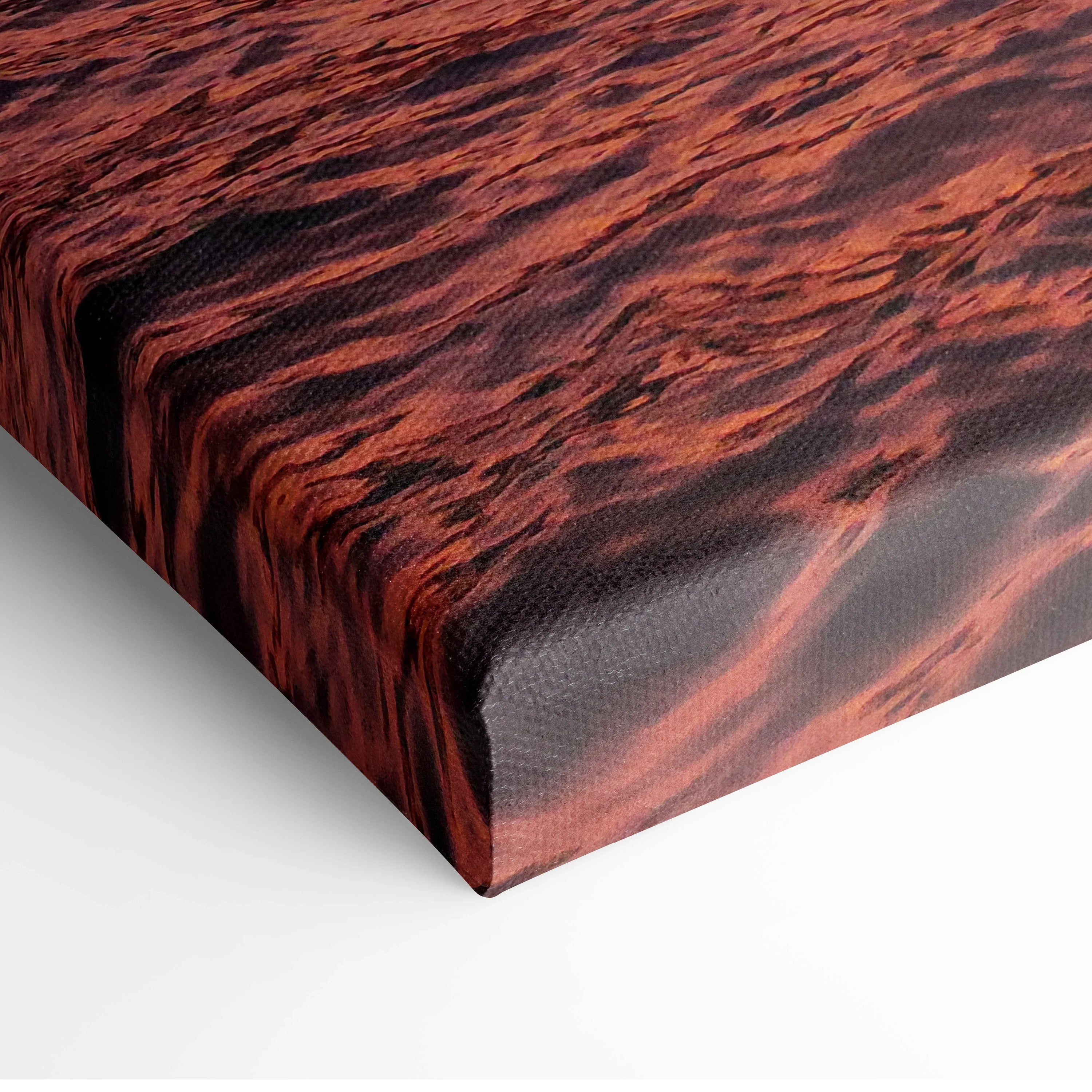 Close-up of urban sunset canvas wall art showing vibrant red and orange sky reflections on textured surface.