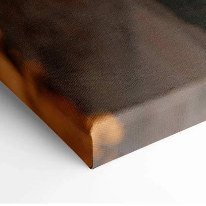 Corner view of canvas wall art with dark city sunset tones on stretched frame.