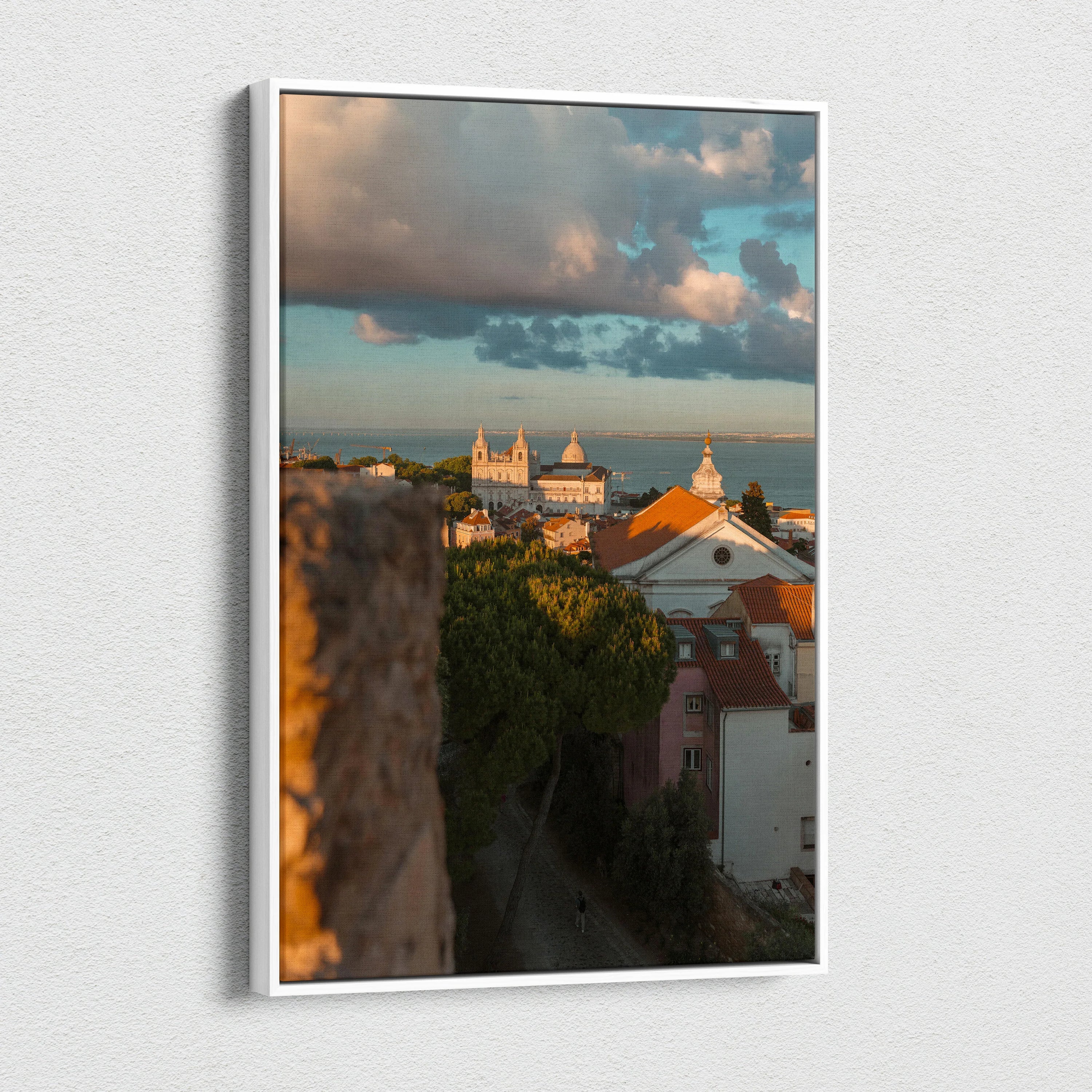 Vertical canvas wall art print of a city skyline at sunset with dramatic clouds and historic buildings.