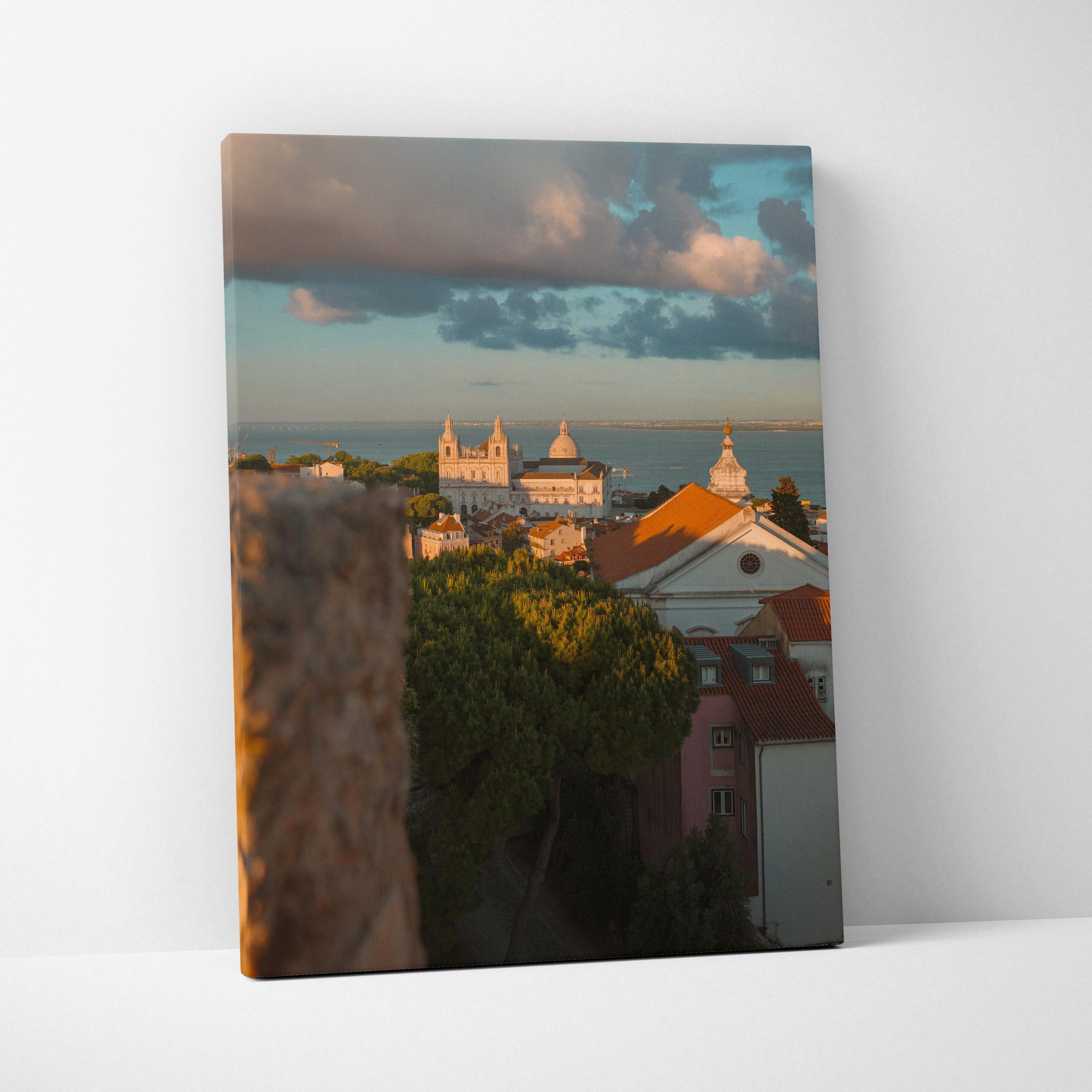 Cityscape canvas wall art featuring historic buildings under a vibrant sunset sky.