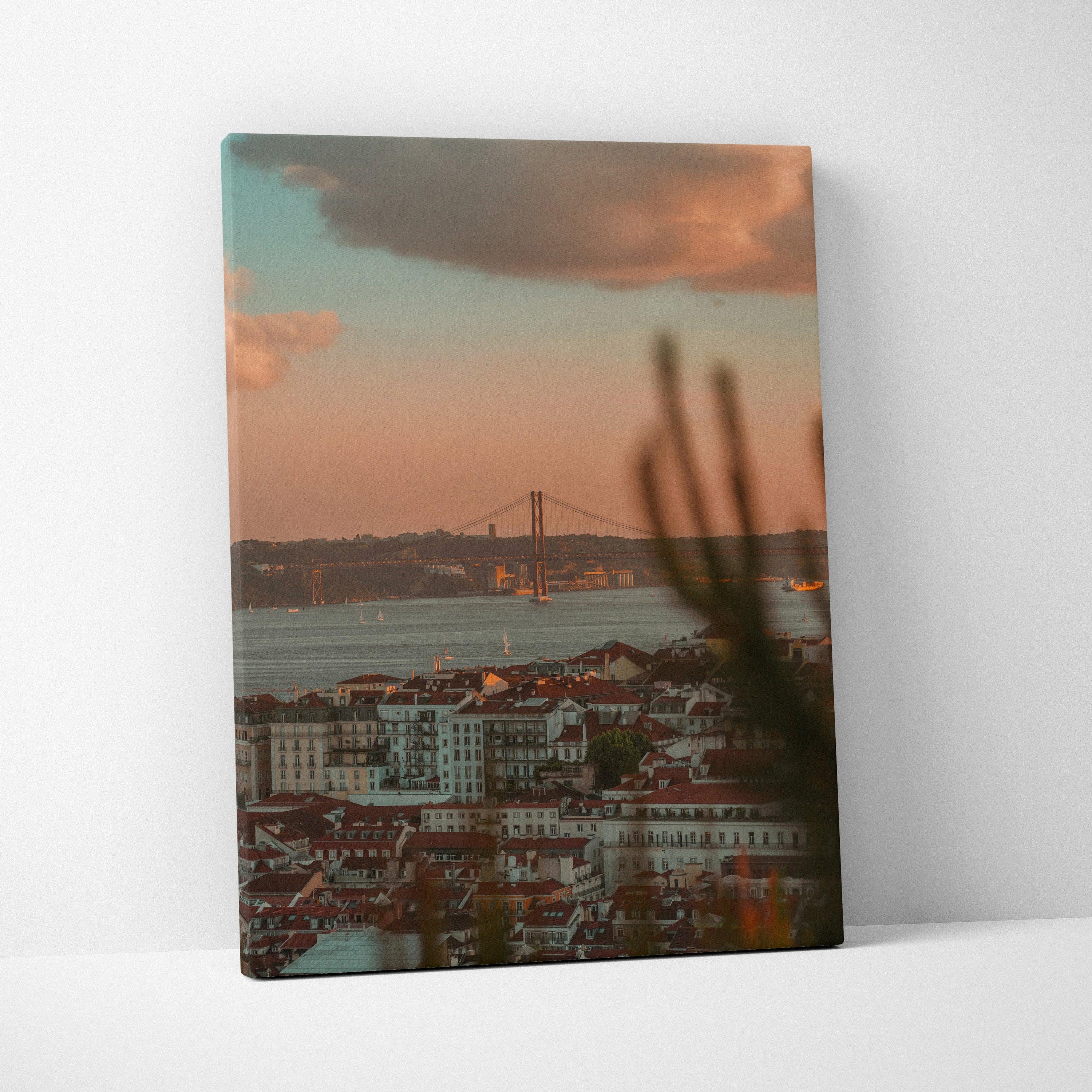 Urban sunset cityscape canvas wall art with buildings and bridge silhouette.