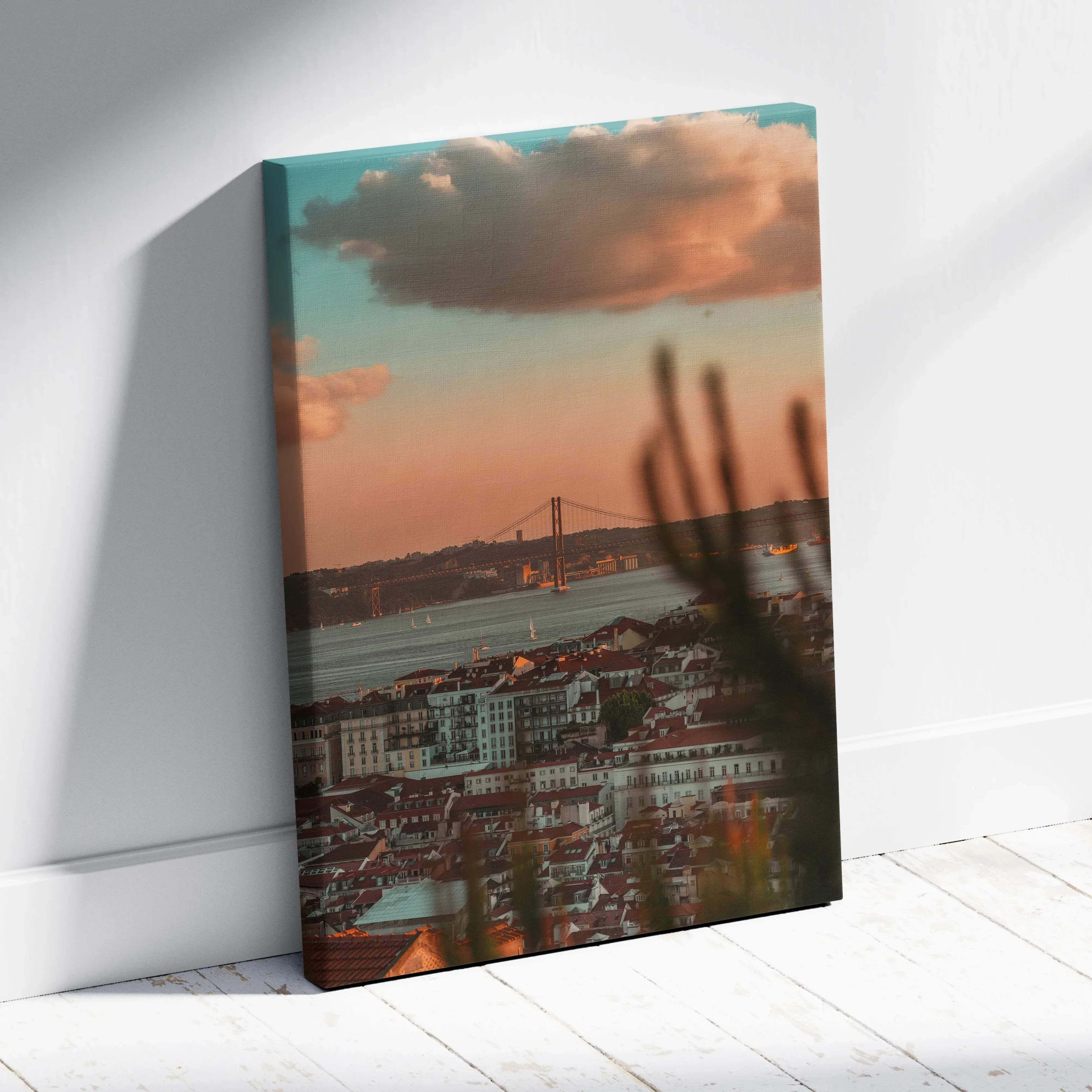 A rectangular canvas print of lisbon cityscape at sunset with warm amber hues over the bridge and rooftops at dusk