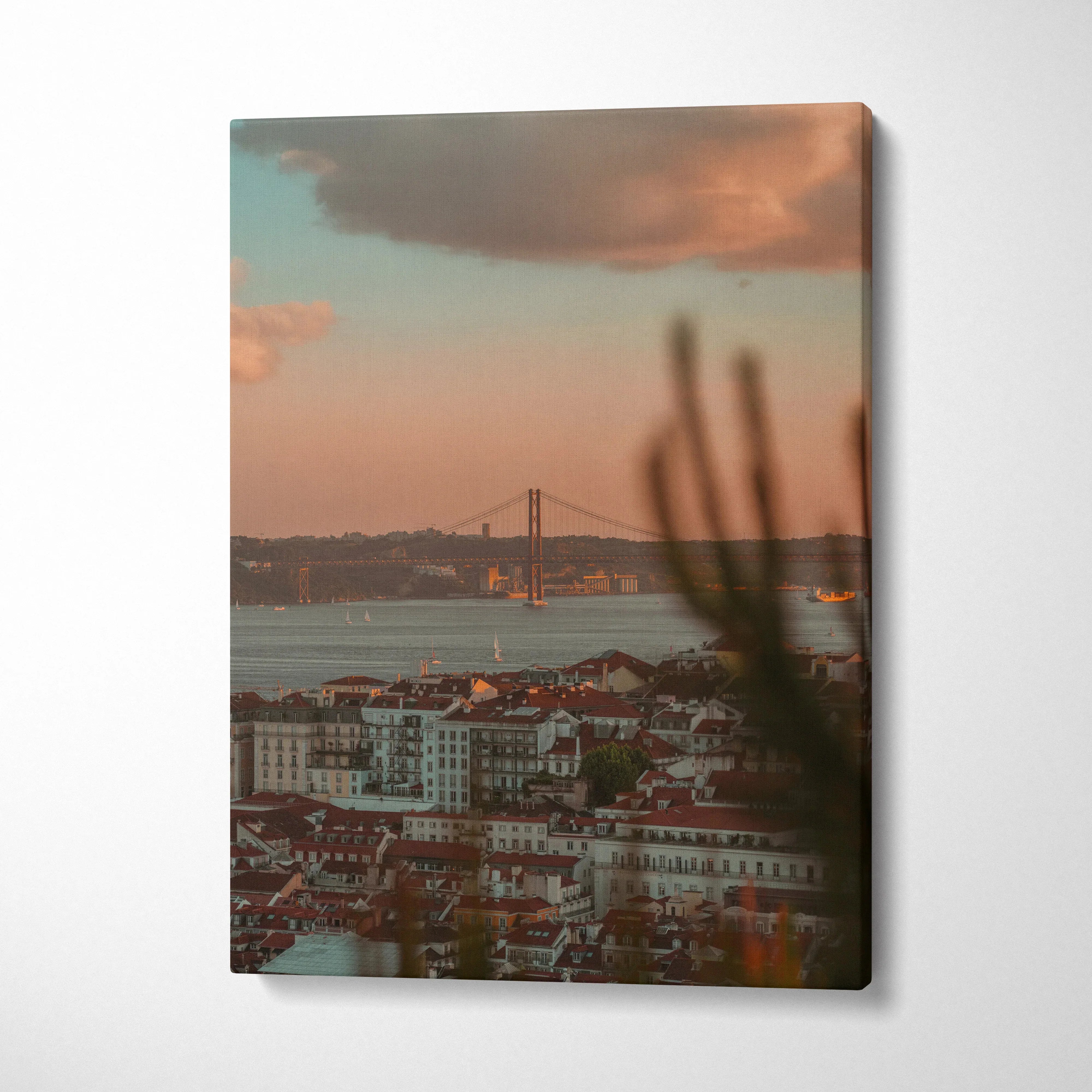 Vertical canvas wall art featuring an urban sunset with buildings and a distant bridge under colorful skies.