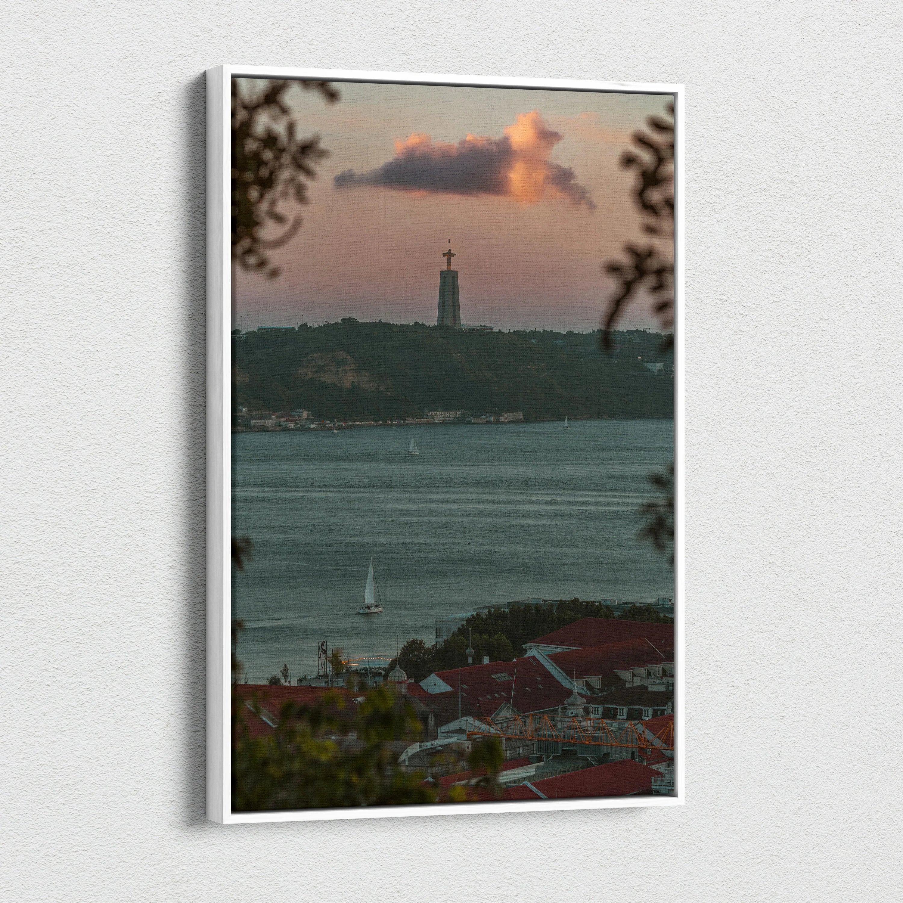 Canvas wall art featuring a city skyline at sunset with a lighthouse and calm waters.