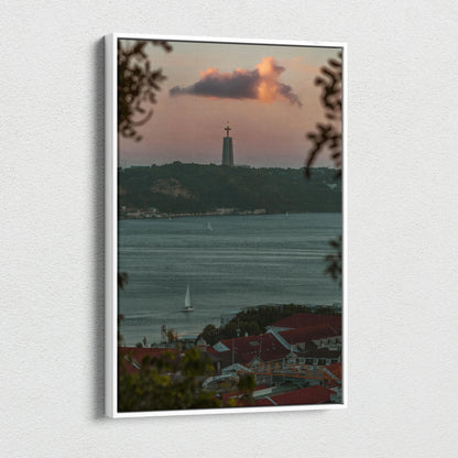 Canvas wall art featuring a city skyline at sunset with a lighthouse and calm waters.