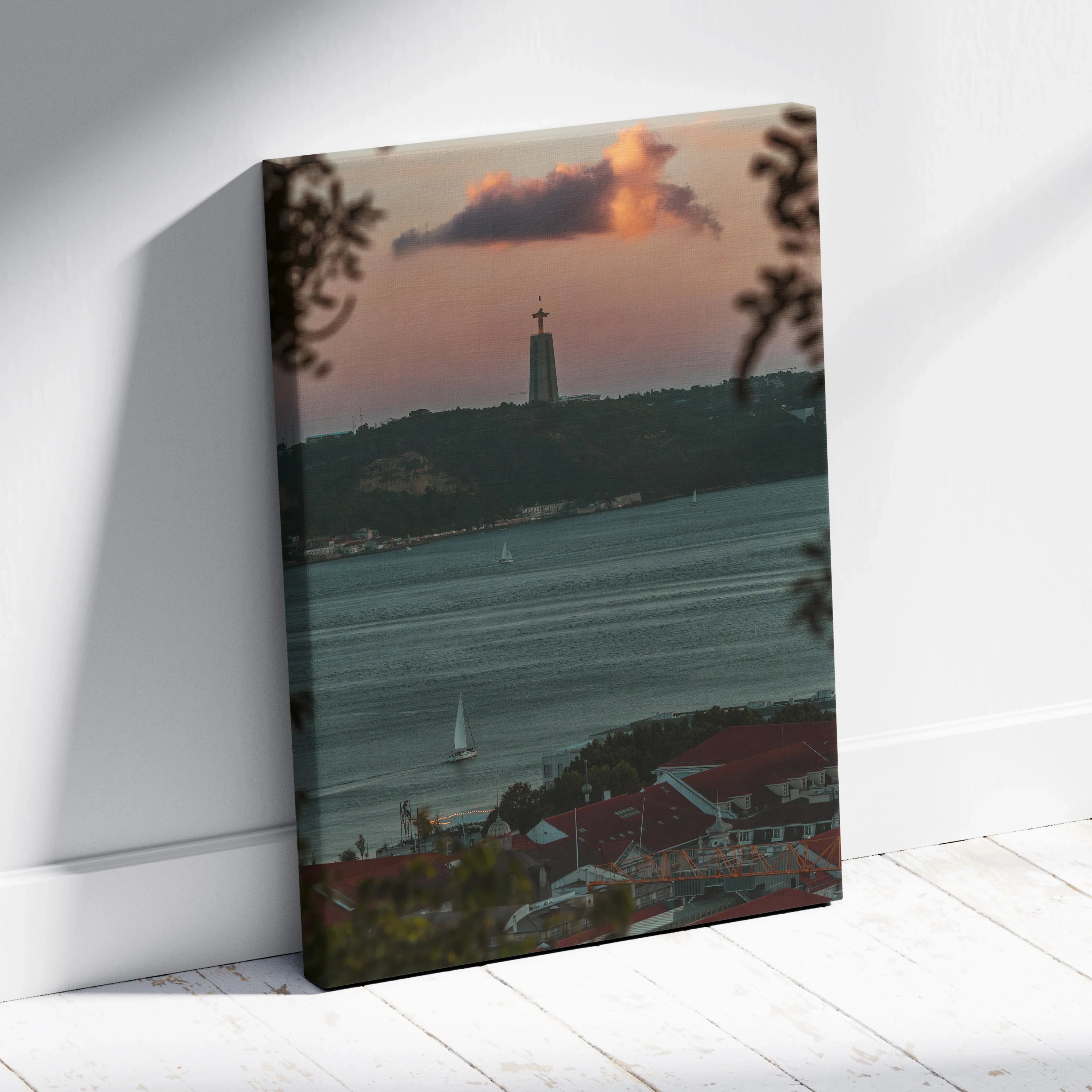 City skyline at sunset with vibrant orange clouds over water, canvas wall art with urban buildings.