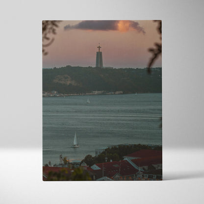 Sunset city skyline canvas wall art with buildings, water, and sailboat in soft evening light.