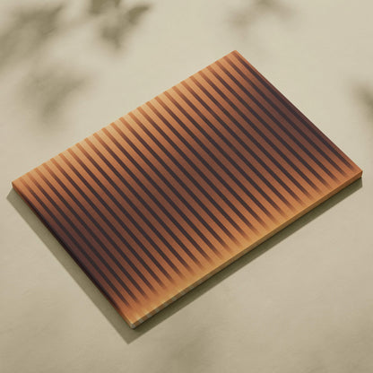 Rectangular wooden cutting board with grooves in golden amber tones