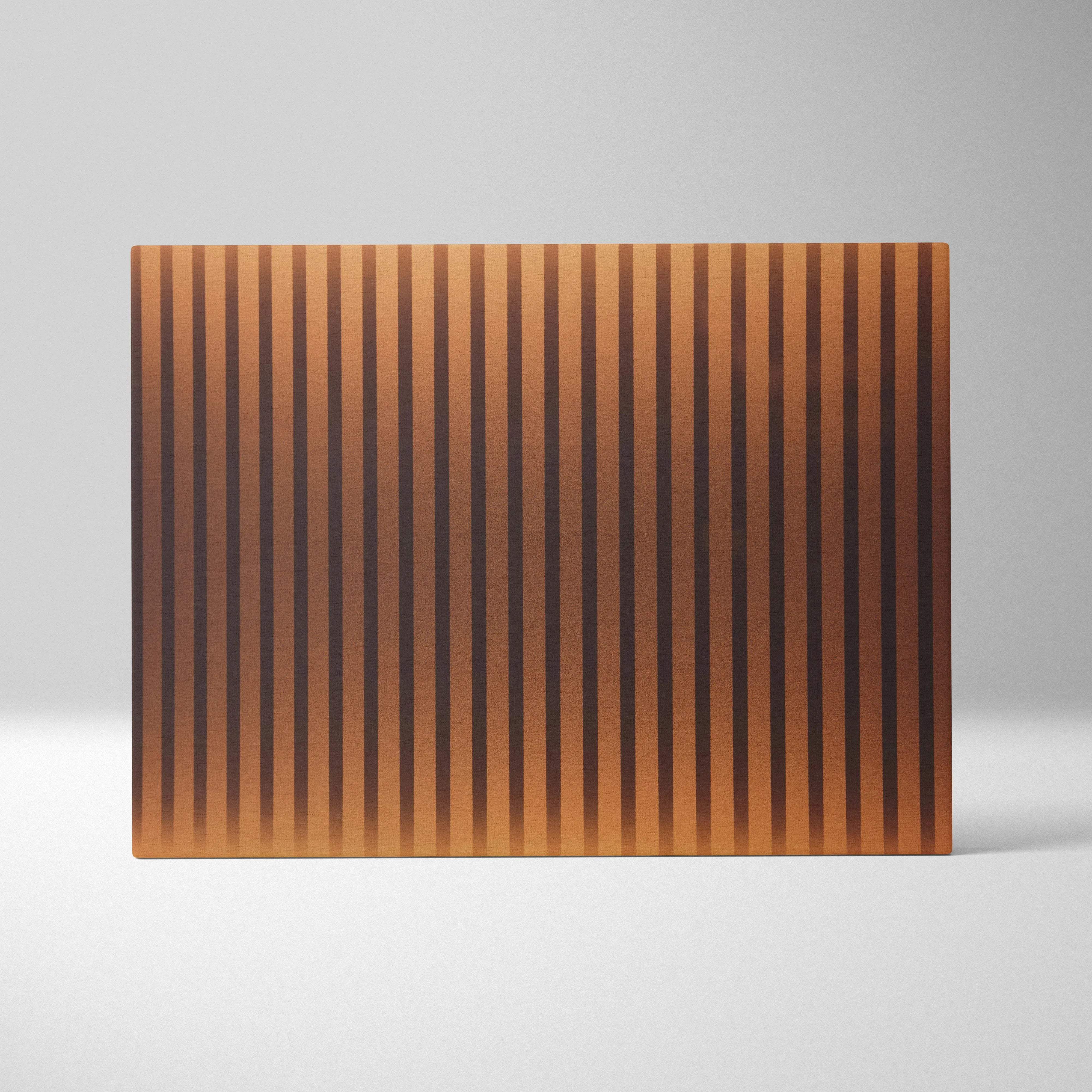 Rectangular copper cutting board with vertical grooves in golden amber tones