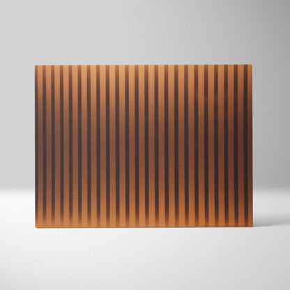 Rectangular copper cutting board with vertical grooves in golden amber tones