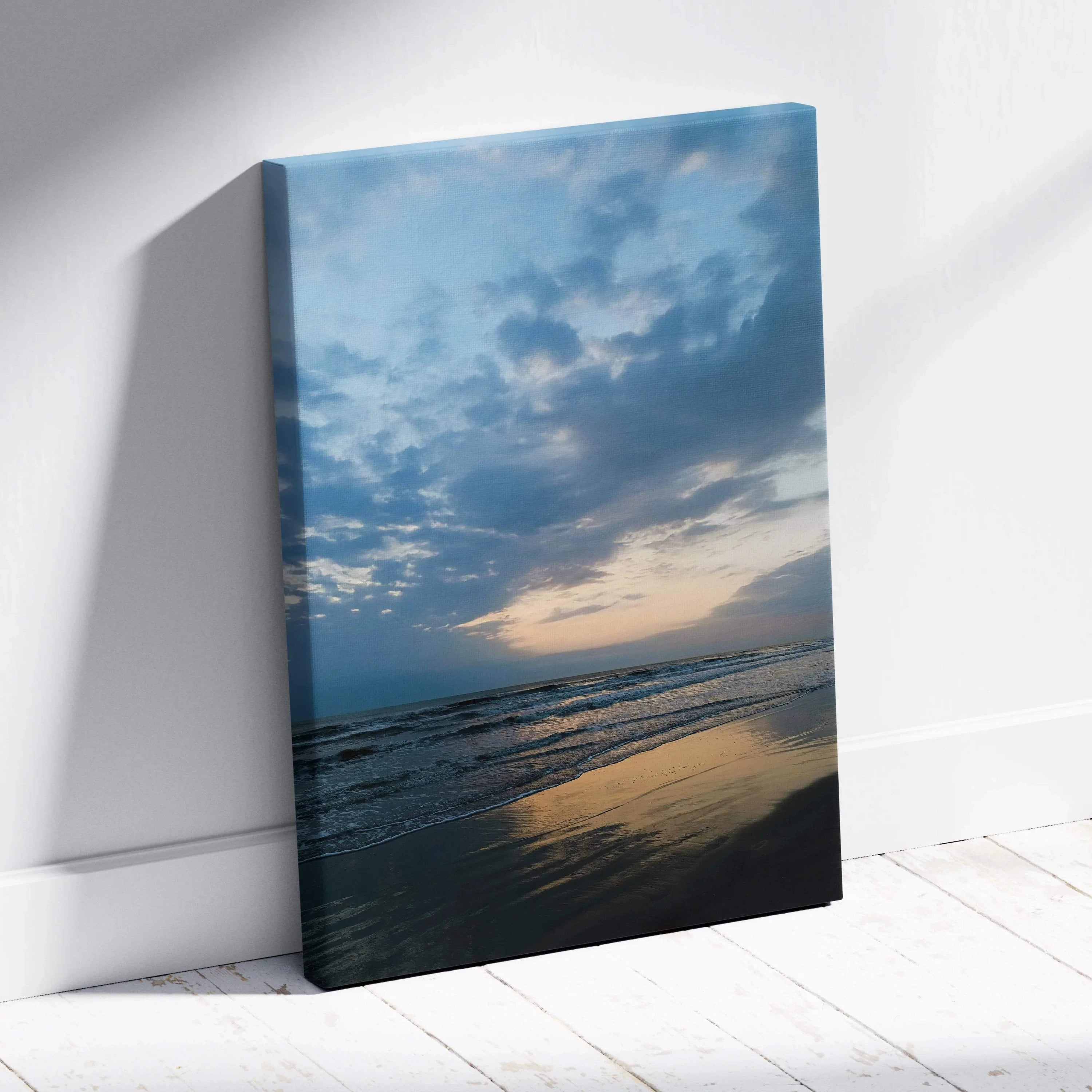 Canvas wall art featuring a tranquil beach sunset with reflective water and soft clouds.