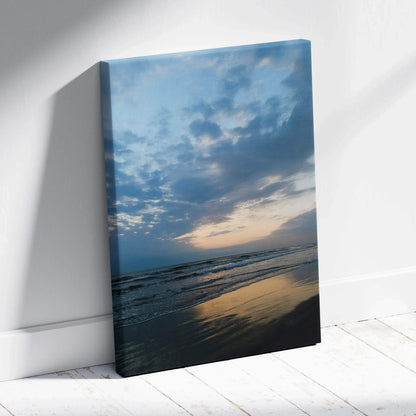 Canvas wall art featuring a tranquil beach sunset with reflective water and soft clouds.