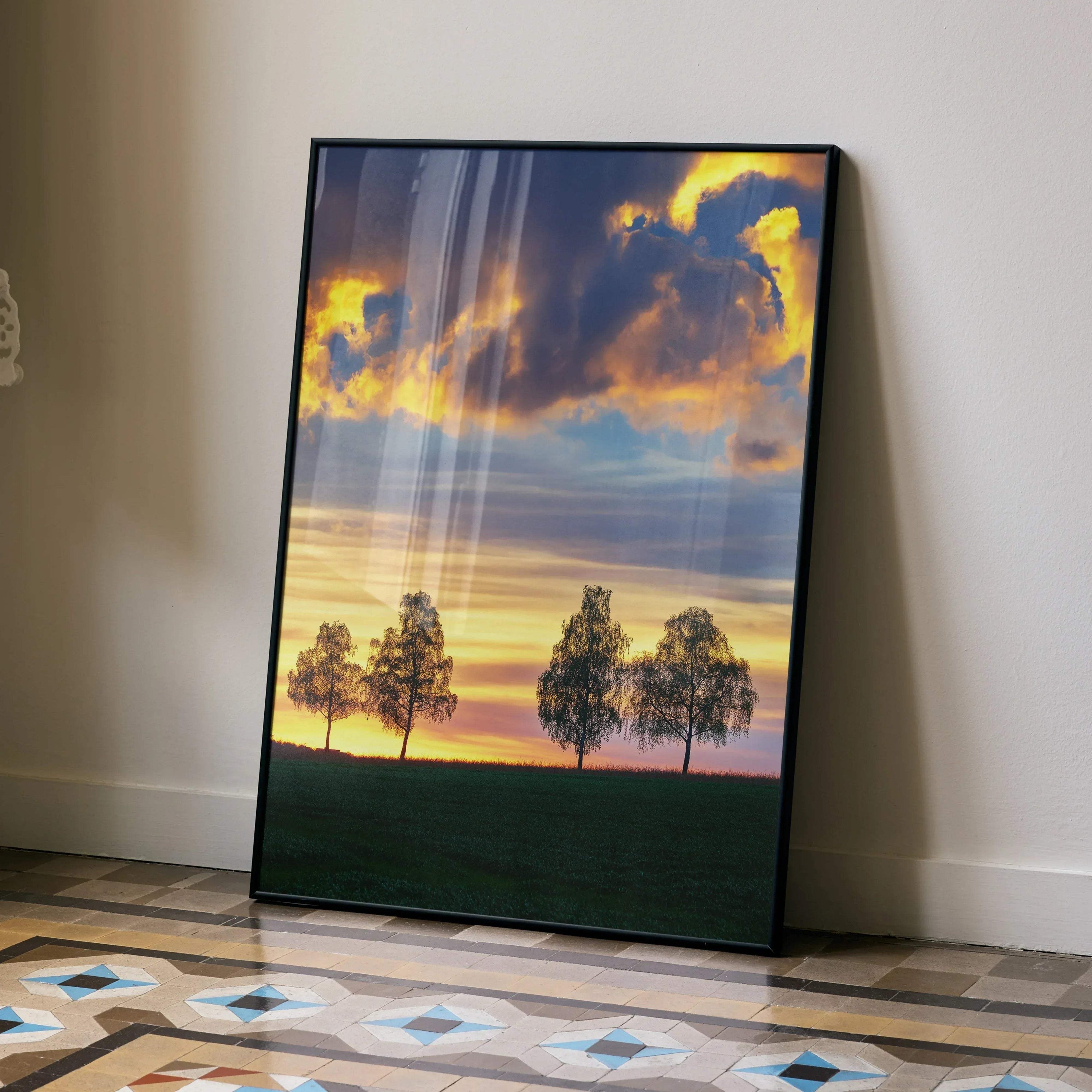 Golden hour sunset nature wall art poster with silhouetted trees and vibrant sky colors.