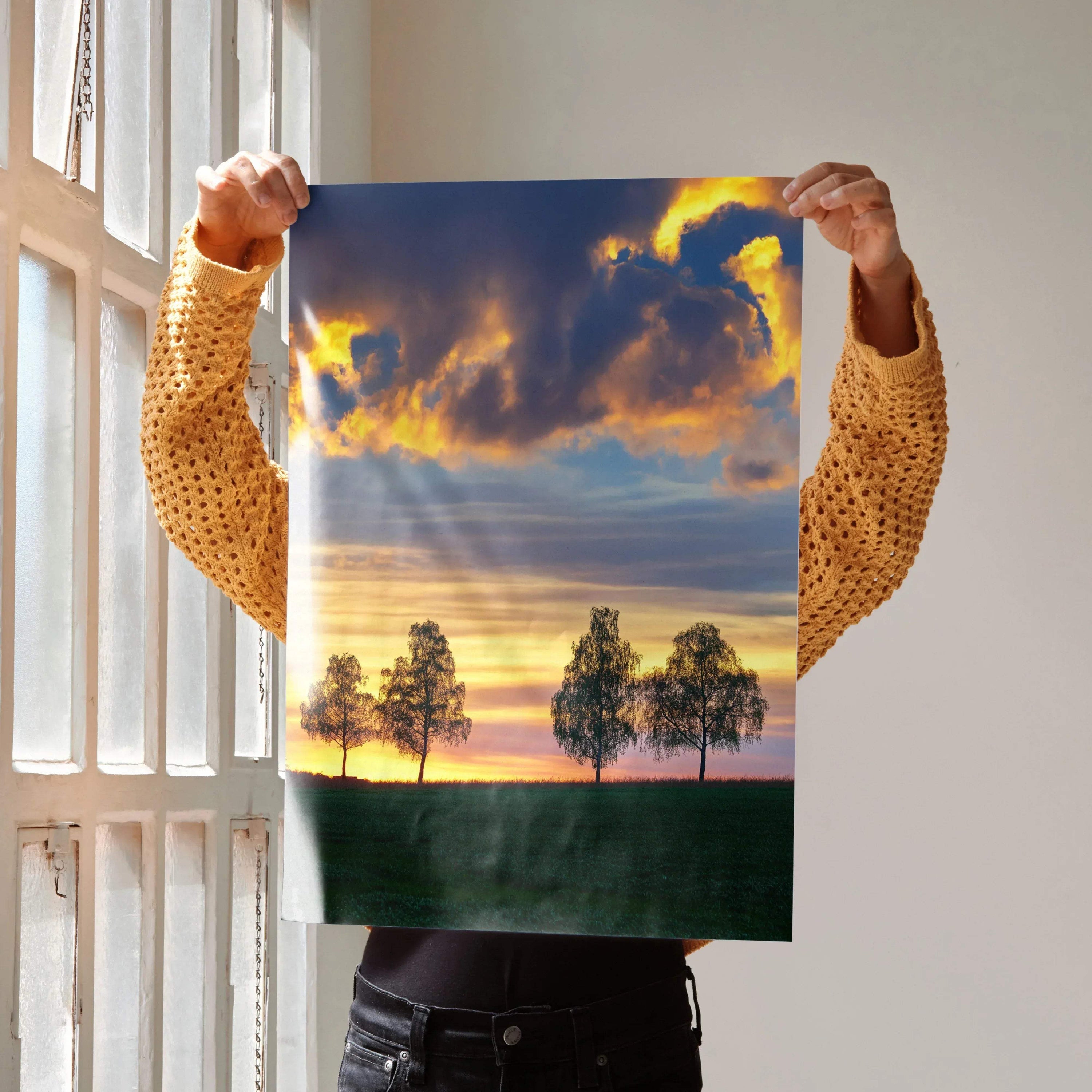 Golden hour sunset nature poster with silhouetted trees and dramatic cloudscape wall art.