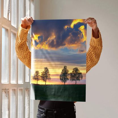 Golden hour sunset nature poster with silhouetted trees and dramatic cloudscape wall art.