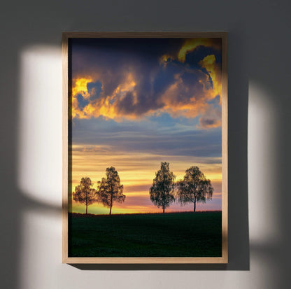 Vertical poster wall art featuring a golden hour sunset with silhouetted trees and vibrant clouds.