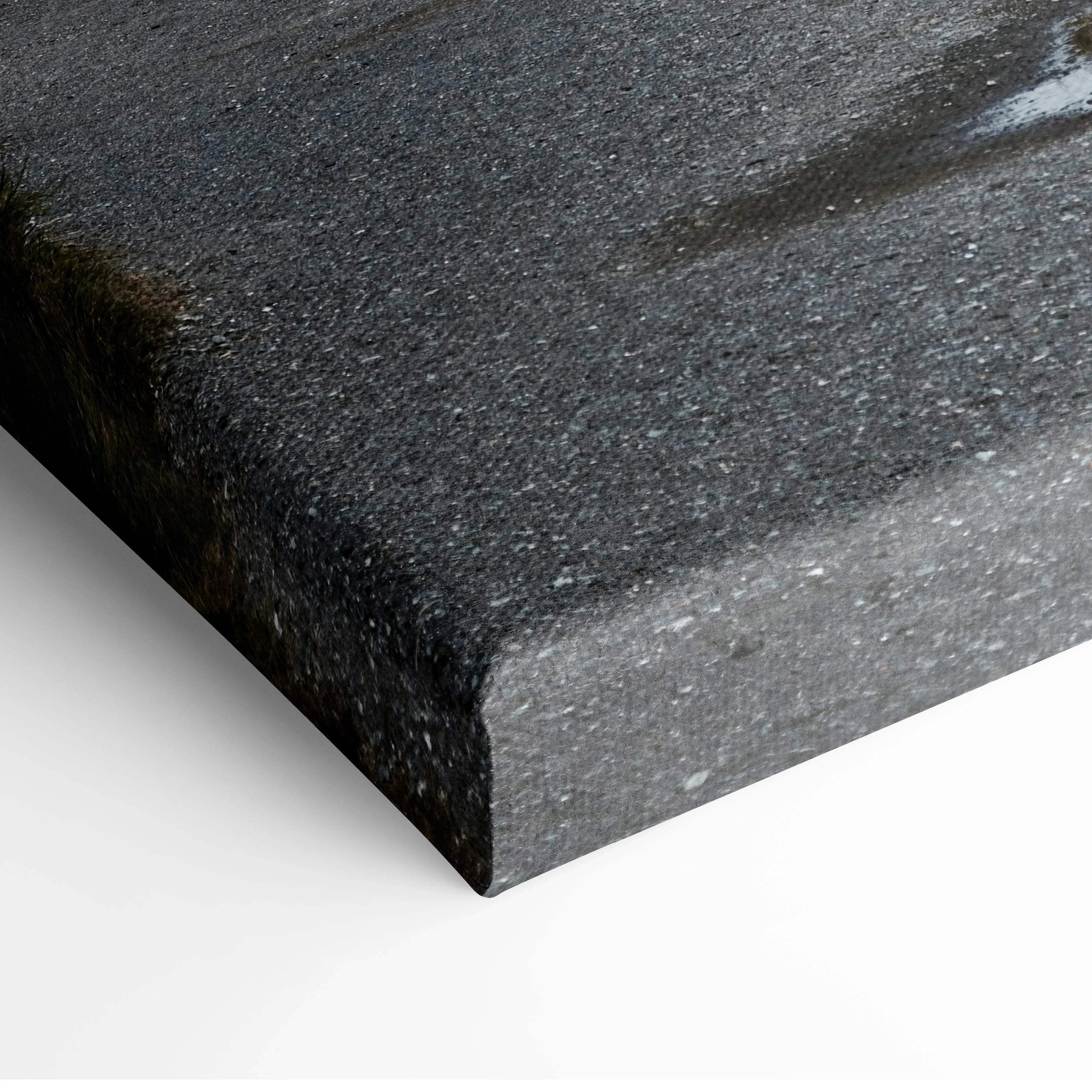 Close-up of textured canvas edge on coastal lighthouse wall art print.